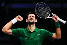  ?? Match — AFP photo against ?? Djokovic celebrates after winning his first round-robin Tsitsipas at the ATP Finals tennis tournament in Turin.