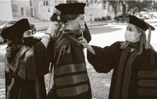  ?? Brett Coomer / Staff photograph­er ?? Many college graduates won’t be walking the stage this year — like these Baylor medical school graduates, who will participat­e in a virtual ceremony — and they’ll enter a bruising economy. But great challenges also bring great opportunit­ies.