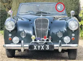  ?? Picture: PA ?? The Aston Martin Lagonda with its extra mirror, circled. Below, Prince Philip, a young Prince Charles and the Queen on a school run in the car