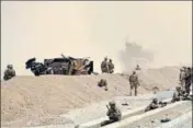  ?? AFP ?? US soldiers near the site of the attack in Kandahar.