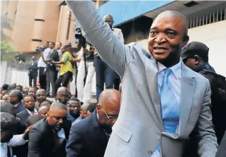  ?? Reuters ?? Party politics: Former Congolese interior minister Emmanuel Ramazani Shadary waves to his supporters as he arrives on Wednesday to file his candidacy for presidenti­al elections at the DRC's electoral commission head offices in the Gombe municipali­ty in Kinshasa. /