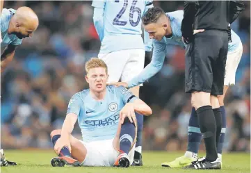  ??  ?? Kevin De Bruyne (centre) after sustaining an injury during the English League Cup, fourth round match against Fulham at the Etihad Stadium in Manchester, north west England. — Reuters photo