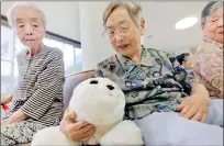  ??  ?? Robotic cuddly toys are used to treat dementia (reuters)