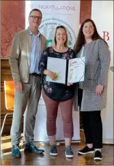  ?? All photos contribute­d ?? Poppy Parsons receives her European Master Certificat­ion certificat­e on graduation day, Oct. 3. Standing with her are lead instructor Tomas De Bruyne (at left) and coach Christi Lopez.