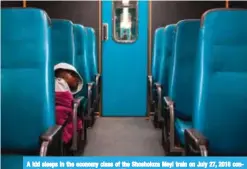  ?? — AFP ?? A kid sleeps in the economy class of the Shosholoza Meyl train on July 27, 2018 connecting Johannesbu­rg to Musina.