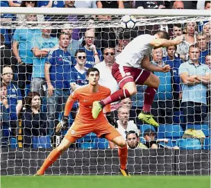  ?? — Reuters ?? Up for it: Sam Vokes scoring Burnley’s third goal against Chelsea at Stamford Bridge.