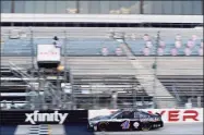  ?? Jared C. Tilton / Getty Images ?? Kevin Harvick, driver of the No. 4 Mobil 1 Ford, crosses the finish line to win the NASCAR Cup Series Drydene 311 Race 2 at Dover Internatio­nal Speedway on Sunday in Dover, Del.