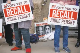  ?? Tony Avelar / Special to The Chronicle ?? Recall Persky Campaign volunteers rally outside the Santa Clara County Registrar of Voters in San Jose. The group turned in almost 100,000 signatures.