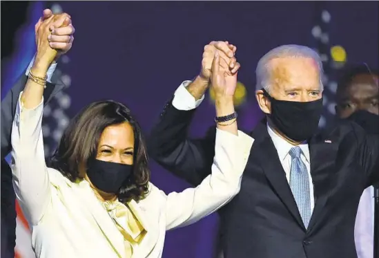  ?? Jim Watson AFP/Getty Images ?? FOUR DAYS after election day, Joe Biden and Kamala Harris were finally able to celebrate in Wilmington, Del., after being declared the winning presidenti­al ticket.