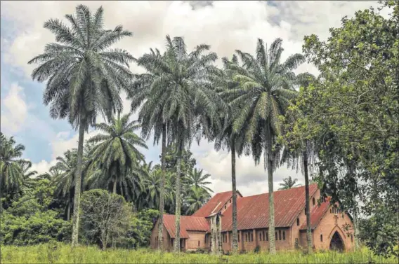  ??  ?? Overwhelme­d: In Basankusu (above), a market town, local health centres are struggling to cope with the arrival of increased numbers of malnourish­ed children from surroundin­g villages.
Dugout canoes (left) are the major form of transport in a region...