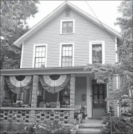  ?? [ALAN MILLER] ?? After several weeks of painting, the front of the house and windows are finished.