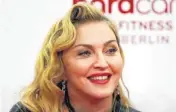 ?? AP FILE PHOTO ?? In October, Madonna attends the opening of a fitness center in Berlin. Madonna visited Haiti recently to see humanitari­an projects that her ex-husband Sean Penn has been overseeing since the Caribbean nation’s devastatin­g earthquake in 2010.