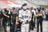  ?? Gerry Broome / Associated Press ?? Driver Brad Keselowski walks to his car on pit road at Charlotte Motor Speedway on Sunday.