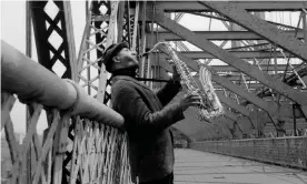  ?? New York Daily News Archive/NY Daily News/Getty Images ?? Sonny Rollins plays his saxophone on the Williamsbu­rg Bridge in New York. Photograph: