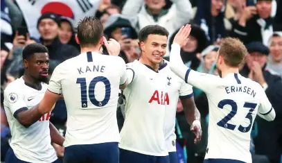  ?? Picture: Reuters ?? CLOSE CALL. Tottenham Hotspur’s Dele Alli (centre) celebrates with team-mates after the winning goal in their 2-1 win over Brighton at Tottenham Hotspur Stadium yesterday.