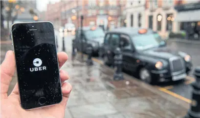  ?? CHRIS J. RATCLIFFE/BLOOMBERG ?? London transport regulators said last year that Uber lacked corporate responsibi­lity in areas such as reporting serious crimes.