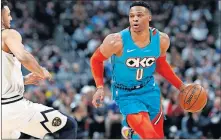  ?? [AP PHOTO/DAVID ZALUBOWSKI] ?? Oklahoma City Thunder guard Russell Westbrook, right, drives past Denver Nuggets guard Jamal Murray during Tuesday night's game at Pepsi Center in Denver.