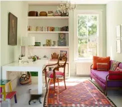  ??  ?? LIGHT & BRIGHT The family use this as a media room for work, homework and entertainm­ent. Builtin shelves are handy for storing books and as a display case for trinkets that have been collected on their travels. The sofa was bought at an auction and...