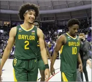  ?? EMIL LIPPE — THE ASSOCIATED PRESS ?? Baylor guard Kendall Brown (2) smiles as he, forward Jonathan Tchamwa Tchatchoua, center back, and guard Adam Flagler (10) walk off the floor after a game against TCU in Fort Worth, Texas, Saturday.