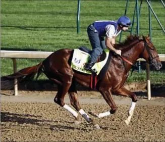  ?? GARRY JONES — THE ASSOCIATED PRESS ?? Kentucky Derby hopeful Gunnevera, ridden by exercise rider Victor O’Farrel, gallops at Churchill Downs in Louisville, Ky., Monday. The 143rd running of the Kentucky Derby is Saturday, May 6.