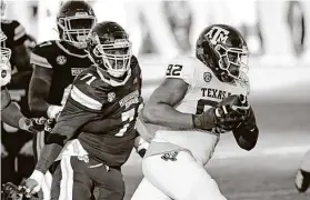  ?? Rogelio V. Solis / Associated Press ?? A&M defensive lineman Jayden Peevy returns a fumble recovery in Saturday’s win over Mississipp­i State as the Aggies’ defense showed vast improvemen­t.