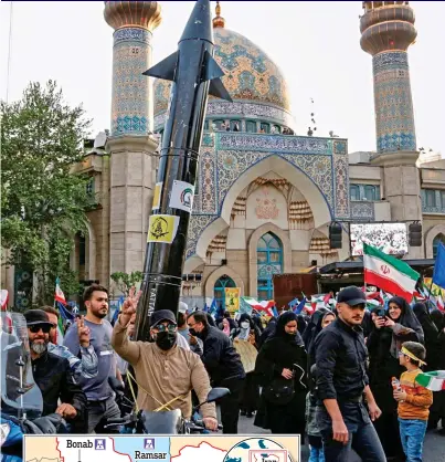  ?? ?? Tehran terror: Iranians celebrate drone attacks