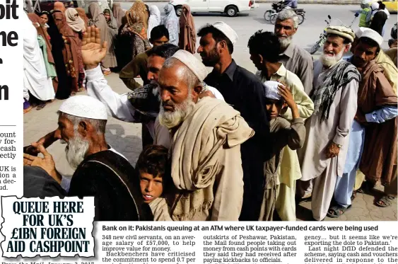  ??  ?? Bank on it: Pakistanis queuing at an ATM where UK taxpayer-funded cards were being used