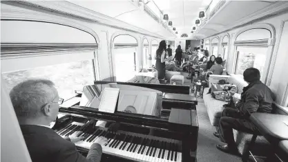  ?? Tribune News Service ?? Singer Pierina Less performs a varied repertoire of music for guests in the Piano Bar Car.