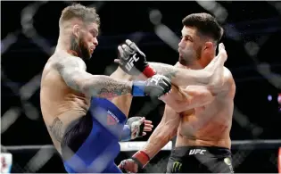  ?? (AP) ?? IN THIS Dec. 30, 2016, file photo, Cody Garbrandt, left, tries to kick Dominick Cruz during a bantamweig­ht championsh­ip mixed martial arts bout at UFC 207 in Las Vegas. Garbrandt rocketed to the top of the UFC’s bantamweig­ht division and then lost his...