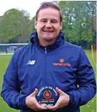  ?? ?? Goalkeeper Ryan Boot and boss Neal Ardley, right, with their Vanarama awards for October