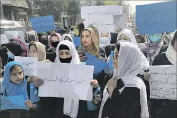  ?? Mohammed Shoaib Amin Associated Press ?? AFGHANS chant during a demonstrat­ion in Kabul over the treatment of women and girls in the country. Last week, the Taliban decided against reopening schools to girls above sixth grade, reneging on a promise.