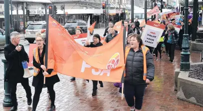  ?? PHOTO: LINDA ROBERTSON ?? Campaign trail . . . Dunedin PSA members move through the Octagon yesterday during a march in support of better pay. It was the first time in 22 years PSA members at Inland Revenue had taken strike action.