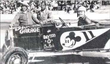  ?? CONTRIBUTE­D ?? The late Charlie Black (in plaid jacket) was owner and builder of the No. 11 Mickey Mouse roadster race car, seen here readying for a race at Mount Lawn Speedway near New Castle, Indiana, with Jo Jo Degromes at wheel.