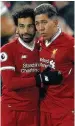  ??  ?? DEVASTATIN­G Kop stars Salah & Firmino