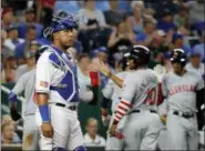  ?? CHARLIE RIEDEL — ASSOCIATED PRESS ?? Royals catcher Salvador Perez stands at the plate while the Indians celebrate Yan Gomes’ grand slam during the sixth inning July 3.