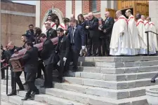  ?? CP PHOTO ?? Anne Marie D’Amico’s casket is followed by family members after her funeral service in Toronto on Wednesday.