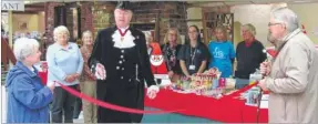  ??  ?? High Sheriff George Jessel opens the Cards for Good Causes stall