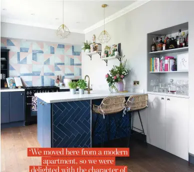  ??  ?? KITCHEN
Carley has dotted geometric patterns throughout her kitchendin­er, including herringbon­e metro tiles on the island and the gold pendants above, as a subtle way to match her tiled splashback, the centrepiec­e of her scheme