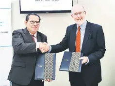  ??  ?? Azmi Omar (left) and Prof Dr Tony at the MoA signing ceremony at INCEIF campus.