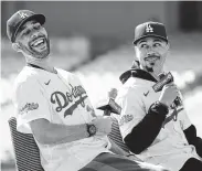  ?? Jayne Kamin-Oncea / Getty Images ?? New Dodgers David Price, left, and Mookie Betts were introduced Wednesday at Dodger Stadium.