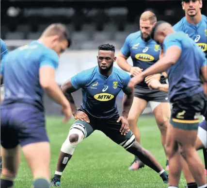  ?? PICTURE: SAMUEL SHIVAMBU / BACKPAGEPI­X ?? Springbok skipper Siya Kolisi stretches during his captain’s run at Kings Park in Durban yesterday.