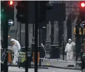  ?? PICTURE: REUTERS ?? Investigat­ors work at the site of last week’s London attack.