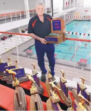  ?? ADOLPHE PIERRE-LOUIS/JOURNAL ?? Albuquerqu­e Academy swimming coach Dave Barney, shown here on June 3, 2015, led the boys swim team to 21 state titles and the girls to 18. He will receive this year’s 2018 Collegiate/Scholastic Swimming Trophy.