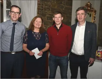  ??  ?? Retiring Banteer Ladies Football and Camogie child welfare officer Noreen O’Brien with Patrick Buckley, guest Lorcán McLoughlin and Donncha Foley.