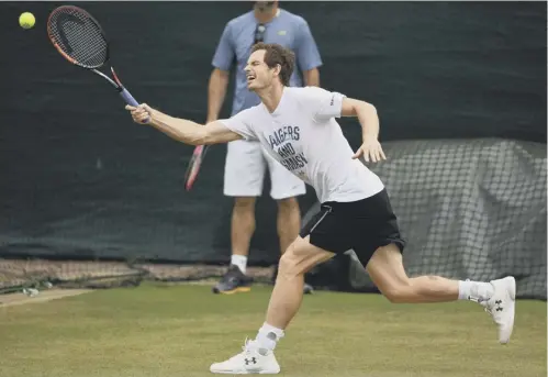  ??  ?? 0 Andy Murray stretches to reach a return as he practises for his quarter-final against Sam Querrey yesterday.