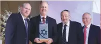  ?? (Knesset) ?? RABBI CHAIM BROVENDER (second right) looks to receive his award, accompanie­d by Regional Cooperatio­n Minister Tzachi Hanegbi (center) and Nefesh B’Nefesh cofounders Rabbi Yehoshua Fass (left) and Tony Gelbart.