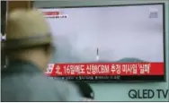  ?? THE ASSOCIATED PRESS ?? A man watches a TV news program reporting about North Korea’s missile firing with a file footage, at Seoul Train Station in Seoul, South Korea, Saturday. A North Korean mid-range ballistic missile apparently failed shortly after launch Saturday, South...