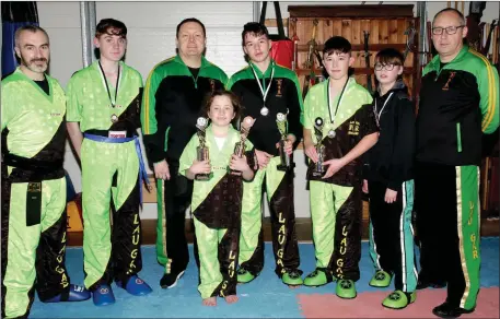  ??  ?? Wexford Kung Fu and Kickboking Club members who won medals at the recent new year open kickboxing championsh­ips in City West Hotel, Dublin (from left): Mark Rowe, T.J. Redmond, Bobby O’Neill, Lily Moran, Cathal Moran, Adam Tierney, Nathan Casserly and Pat Monahan.