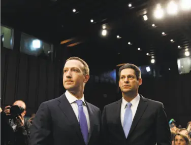  ?? Tom Brenner / New York Times 2018 ?? Facebook CEO Mark Zuckerberg and Joel Kaplan, the vice president of global public policy, before the start of a Senate hearing in April 2018. Big tech firms are now spending more freely on lobbying.