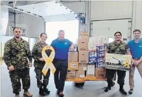  ??  ?? Gift boxes from the Yellow Ribbon Campaign are loaded at CFB Trenton recently. The donations are going to troops in Mali.